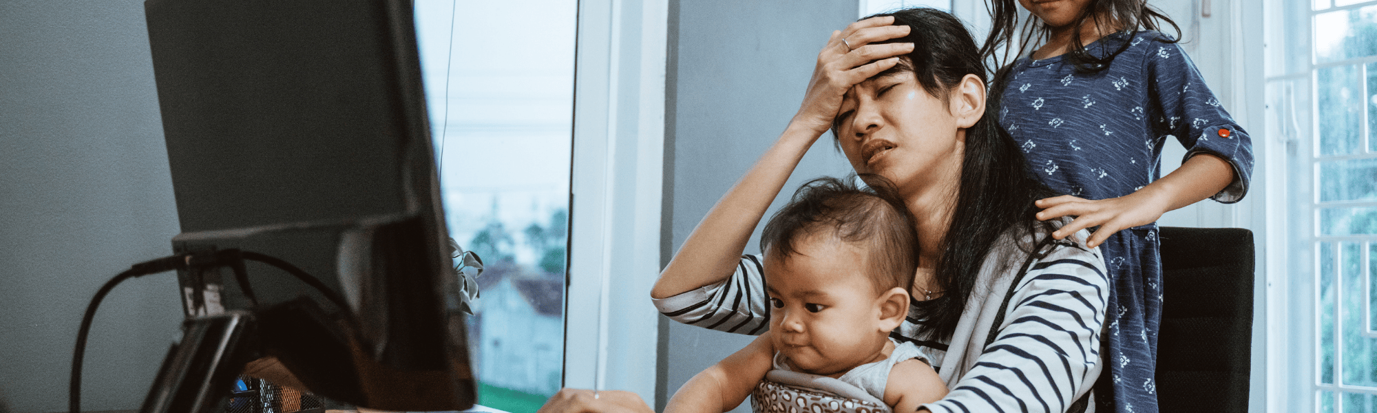 Mom stressed at computer