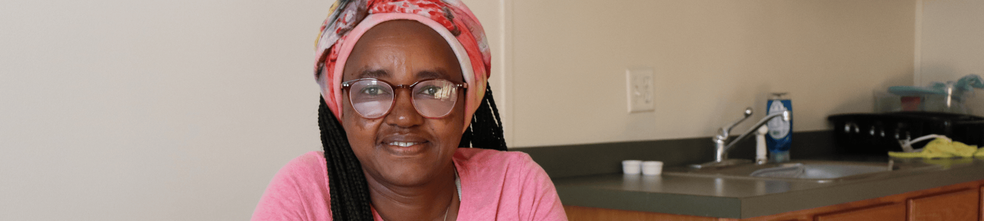 woman sitting at kitchen table