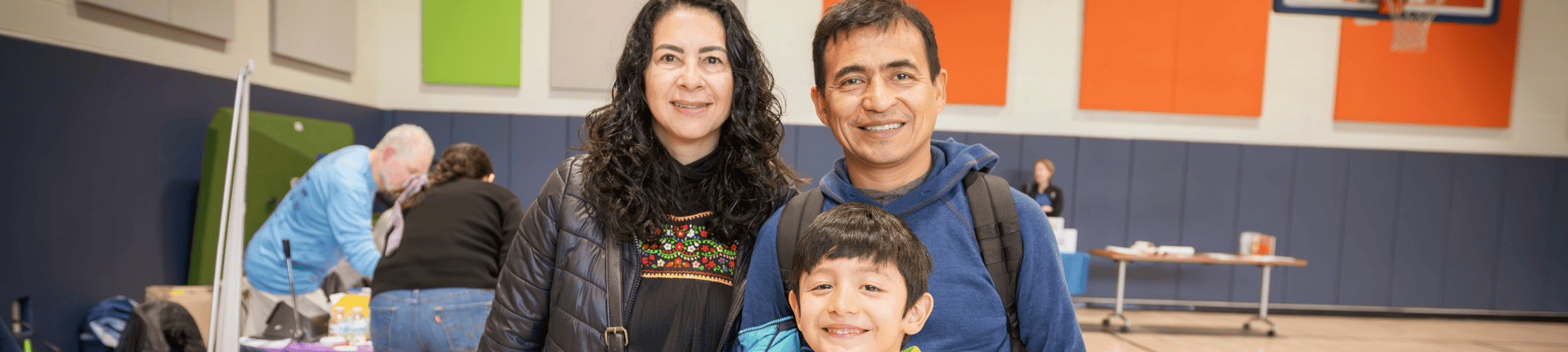 parents smiling with son