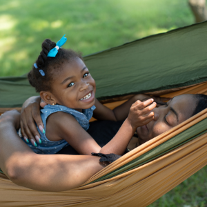 girl in hammock with mother
